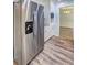 Updated kitchen with stainless steel refrigerator and white cabinets, offers modern style at 5621 Wildwood Trl, Lithonia, GA 30038