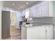 Kitchen featuring stainless steel appliances, white cabinets and stone countertops at 5621 Wildwood Trl, Lithonia, GA 30038