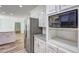 Bright kitchen features stainless steel appliances, granite countertops, and white cabinetry at 5621 Wildwood Trl, Lithonia, GA 30038