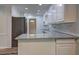 This kitchen has a breakfast bar with granite countertops and white subway tile backsplash at 5621 Wildwood Trl, Lithonia, GA 30038