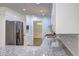 Kitchen featuring stainless steel appliances, white cabinets and stone countertops at 5621 Wildwood Trl, Lithonia, GA 30038