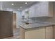 This kitchen features a breakfast bar, granite countertops and stainless steel appliances at 5621 Wildwood Trl, Lithonia, GA 30038