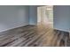 Open-concept living room featuring hardwood floors and natural light at 5621 Wildwood Trl, Lithonia, GA 30038