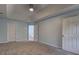 Main bedroom has neutral walls and carpet at 5621 Wildwood Trl, Lithonia, GA 30038