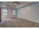 Spacious main bedroom with neutral carpet and recessed lighting at 5621 Wildwood Trl, Lithonia, GA 30038