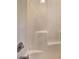 Clean white shower unit with clear fixtures and functional design, providing a minimalist bathing space at 5621 Wildwood Trl, Lithonia, GA 30038