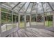 This sunroom has multiple windows and doors, providing lots of light and outdoor access at 5621 Wildwood Trl, Lithonia, GA 30038