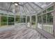This sunroom is bright and airy, with floor to ceiling windows and backyard access at 5621 Wildwood Trl, Lithonia, GA 30038