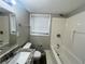 Standard bathroom featuring a shower-tub, toilet, and granite sink with a mirror at 1263 Shoreham Dr, Atlanta, GA 30349