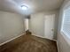 Standard bedroom with neutral walls and brown carpet, and a double window at 1263 Shoreham Dr, Atlanta, GA 30349