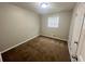 Standard bedroom with neutral walls and brown carpet, features a double window at 1263 Shoreham Dr, Atlanta, GA 30349