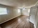 Bedroom with neutral walls, wood flooring, and multiple windows at 1263 Shoreham Dr, Atlanta, GA 30349
