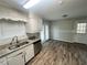 Kitchen featuring granite countertops, stainless steel appliances, and wood flooring at 1263 Shoreham Dr, Atlanta, GA 30349