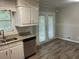 Kitchen area with granite countertops, stainless steel dishwasher and white cabinets at 1263 Shoreham Dr, Atlanta, GA 30349
