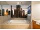 Bathroom featuring a soaking tub and beautiful skyline views at 20 10Th Nw St # 2003, Atlanta, GA 30309