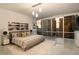 Bright bedroom features walls of windows and a modern aesthetic during sunset at 20 10Th Nw St # 2003, Atlanta, GA 30309