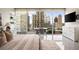 Bright bedroom featuring city views from floor to ceiling windows with contemporary design at 20 10Th Nw St # 2003, Atlanta, GA 30309