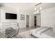 Modern bedroom featuring a television, ensuite, and a study area at 20 10Th Nw St # 2003, Atlanta, GA 30309