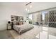 Bright bedroom features walls of windows and a modern aesthetic at 20 10Th Nw St # 2003, Atlanta, GA 30309