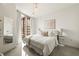 Bright, modern bedroom featuring a large window and elegant decor for peaceful living at 20 10Th Nw St # 2003, Atlanta, GA 30309