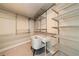 Walk-in closet with custom shelving and a desk area at 20 10Th Nw St # 2003, Atlanta, GA 30309