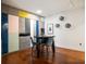 Dining area featuring custom colorful cabinets, hardwood floors, and modern track lighting at 20 10Th Nw St # 2003, Atlanta, GA 30309