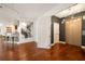 Elegant entrance hall with hardwood floors, an Eiffel Tower picture and a stylish elevator at 20 10Th Nw St # 2003, Atlanta, GA 30309