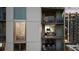 Exterior view showing multiple balconies with tables and chairs that overlook the city at 20 10Th Nw St # 2003, Atlanta, GA 30309