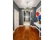 Modern hallway featuring sleek hardwood floors, contemporary lighting, and stylish elevator at 20 10Th Nw St # 2003, Atlanta, GA 30309