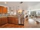 Open-concept kitchen featuring granite countertops and an adjacent living area with city views at 20 10Th Nw St # 2003, Atlanta, GA 30309