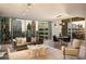 Inviting living room with hardwood floors, modern furniture, and a large city view through expansive windows at 20 10Th Nw St # 2003, Atlanta, GA 30309