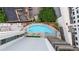 Stunning aerial view of a rooftop pool with lounge chairs and city views at 20 10Th Nw St # 2003, Atlanta, GA 30309