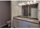 Bathroom with dual sinks, granite countertops and shower and tub combo at 210 Park Place Trl, Social Circle, GA 30025