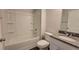 Bright bathroom with a shower-tub combination and granite countertop at 210 Park Place Trl, Social Circle, GA 30025