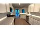 Modern kitchen with stainless steel appliances and stone countertops at 210 Park Place Trl, Social Circle, GA 30025