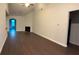 Spacious living room featuring vaulted ceilings, dark hardwood flooring and fireplace at 210 Park Place Trl, Social Circle, GA 30025