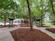 Community park with exercise area, walking paths, and landscaping at 210 Park Place Trl, Social Circle, GA 30025
