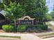 Community entrance sign for Town Park with lush landscaping at 210 Park Place Trl, Social Circle, GA 30025
