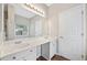 Bright bathroom featuring double sink vanity with large mirror and natural light at 5478 Somer Mill Rd, Douglasville, GA 30134