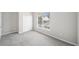 A bedroom features gray carpet, neutral walls and trim, and a large double door closet at 5478 Somer Mill Rd, Douglasville, GA 30134