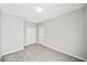 Bedroom features neutral paint, trim and carpet and a double door closet and additional door at 5478 Somer Mill Rd, Douglasville, GA 30134
