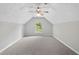Bonus room features neutral walls, carpeting, ceiling fan and bright window at 5478 Somer Mill Rd, Douglasville, GA 30134
