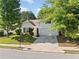 Charming one-story home with a well-maintained lawn, driveway, and classic architectural features at 5478 Somer Mill Rd, Douglasville, GA 30134