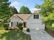 Charming one-story home featuring a manicured lawn, attached garage, and classic architectural details at 5478 Somer Mill Rd, Douglasville, GA 30134