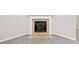 Cozy fireplace featuring tile accents, a decorative mantel, and neutral carpet, set against a neutral wall at 5478 Somer Mill Rd, Douglasville, GA 30134