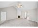 Spacious living room featuring a fireplace, ceiling fan, and neutral carpet and paint at 5478 Somer Mill Rd, Douglasville, GA 30134