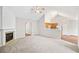 Open-concept living area showcases the fireplace, vaulted ceilings, and adjoining kitchen at 5478 Somer Mill Rd, Douglasville, GA 30134