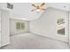 Bright main bedroom featuring vaulted ceilings, ceiling fan, and double windows providing natural light at 5478 Somer Mill Rd, Douglasville, GA 30134