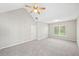 Bright main bedroom featuring vaulted ceilings, ceiling fan, and neutral walls at 5478 Somer Mill Rd, Douglasville, GA 30134