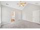 Bright main bedroom featuring vaulted ceilings, ceiling fan, with ensuite bathroom at 5478 Somer Mill Rd, Douglasville, GA 30134